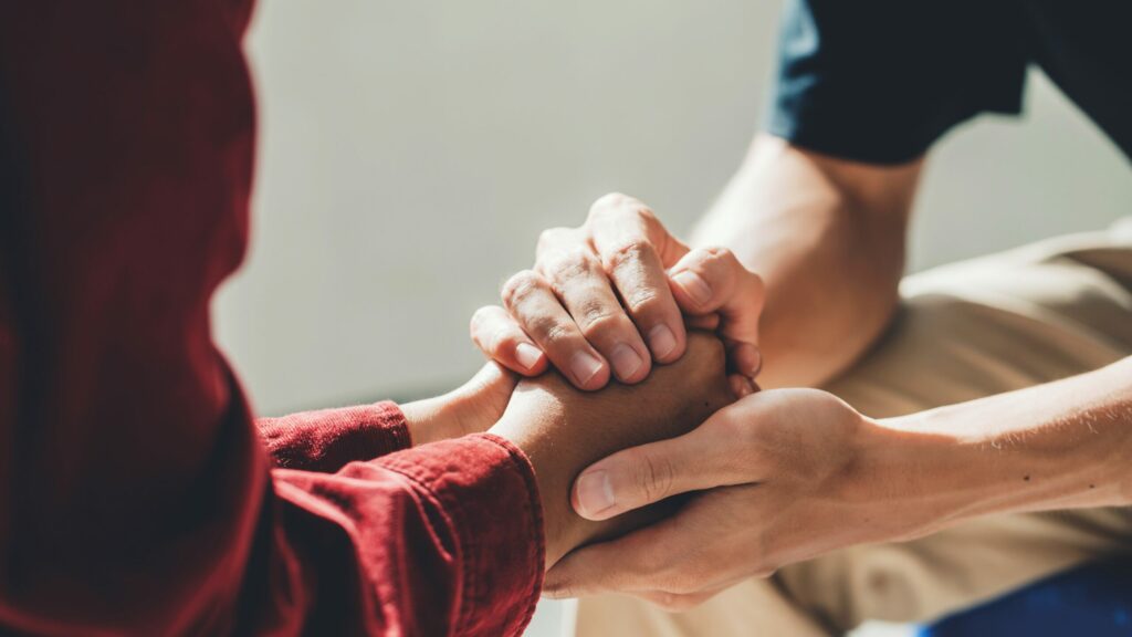 two people holding hands